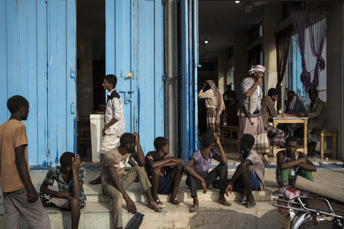 Between Ras Al Arah and Aden. The Oromo people walk for four to five days to reach Aden, the yemeni economical capital. Migrants wait near local restaurants to beg for the leftovers.