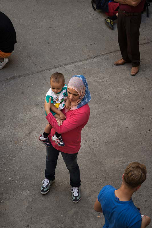 Kos, July 1, 2015.
Jihan and her son Caesar are about to get from the pressed police their temporary residence permit. They had to wait for 10 days to get a document that will allow them to leave the island.   
