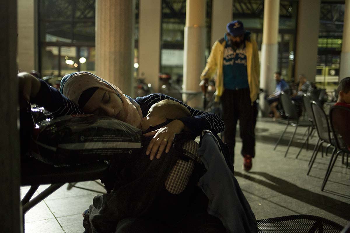 Thessaloniki, July 4, 2015.
Jihan spends the night outside of the bus station because she is waiting, with her group for a smuggler to travel North. the Syrians are not allowed to travel to the border areas so they use traffickers' fast cars.  