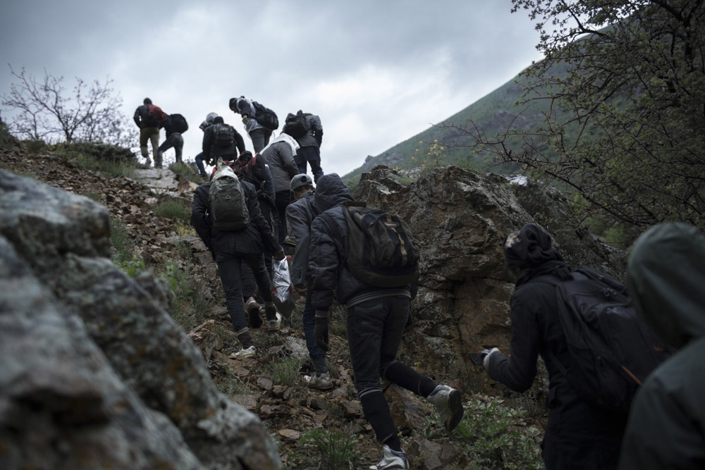 Two smugglers are guiding the travellers through the Kurdish mountains, between Iran and Turkey.
May 17, 2013.
