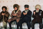 December 14th 1999.
 Funeral of the brother of Commandant Sayed, killed in action in the Shali region a few days earlier.
The elders of the village, including the father of Shamil Basayev (far right), receive the people's condolences.
